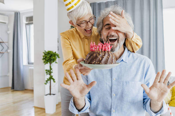 istock Birthday surprise for senior man at home 1402076969