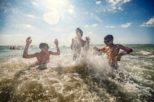 istock Kids enjoying summer vacations in the sea 1402078728