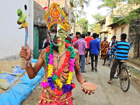 Gajan is a Hindu folk festival celebrated in the villages of West Bengal, India. Here a gajan sanyasi is celebrating the gajan festival at Kurmun village of Bardhaman district of West Bengal, India.