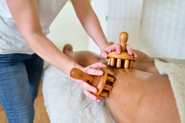 istock Natural wood massage therapy on the leg 1402080394