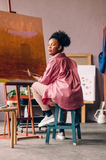 istock A Beautiful Mixed-race Professional Artist Painting In Her Studio 1402082015