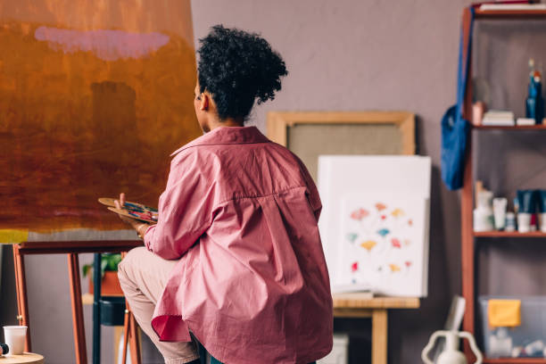 istock An Unrecognizable Mixed-race Professional Artist Painting In Her Studio 1402082016