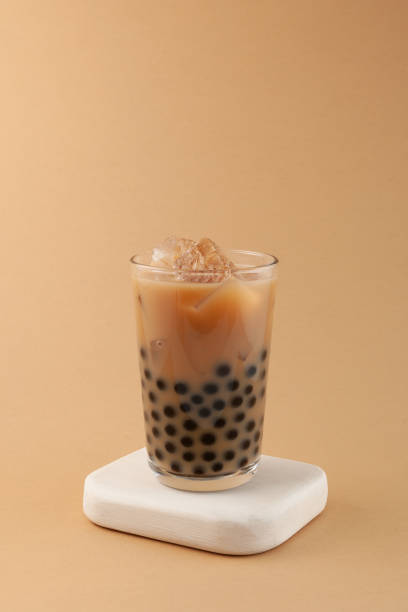 istock Boba milk tea in tall glass. Refreshing iced drink. Bubble tea with tapioca pearls. Vertical orientation, selective focus, copy space 1402082558