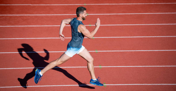 istock man sprinter running from start to finish with success and speed, sport run 1402082624