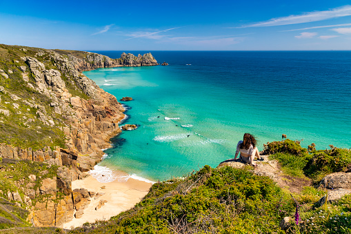 Tucked-away sandy beach famed for its turquoise water, reached by scrambling down a rocky cliff.