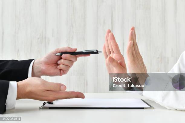 Business Man Recommending Contract And Customer Refusing It Stock Photo - Download Image Now
