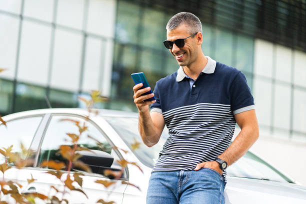 istock Driver in front of a car 1402084679