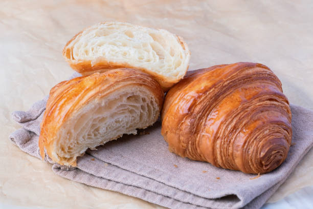 istock Fresh croissants bread on a kitchen paper. 1402084738