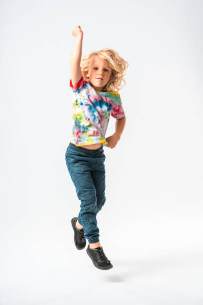 istock Hippie Boy Having Fun Jumping Up And Down 1402084816