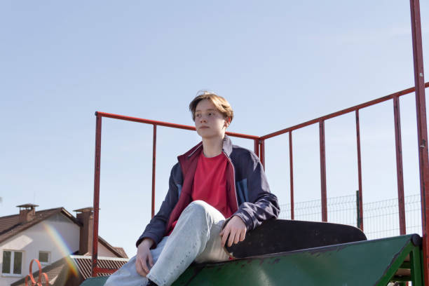 istock A young man is actively skateboarding alone on the street. 1402087240