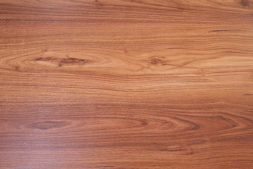 Brown wooden surface from desk view from top