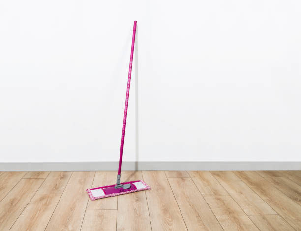 istock cleaning mop close up, on parquet floor 1402092617