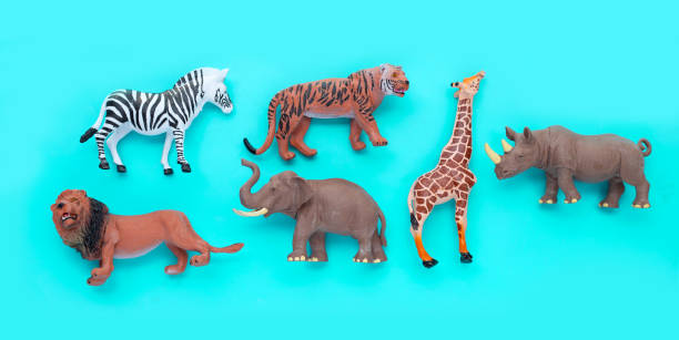 istock Plastic jungle animal toys on blue background. 1402094775