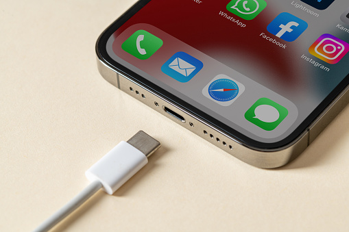 Antalya, TURKEY - June 10, 2022. Apple Iphone 13 Pro and Usb-c or Type-C Wired Charger. EU is forcing all devices to use Usb-c or Type-C