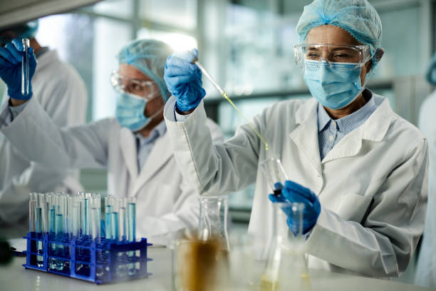 istock Mature scientist working on antiviral drug in laboratory. 1402095902