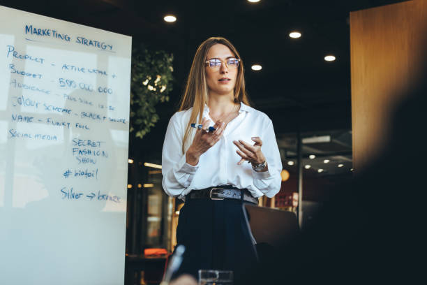 istock Female entrepreneur discussing her marketing strategy with her team 1402095924