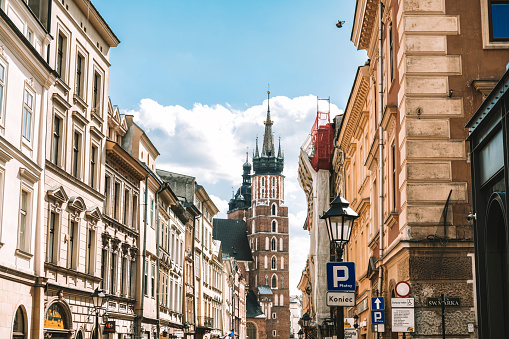istoric old town in Kraków with view on the saint mary´s church in the background under blue sky