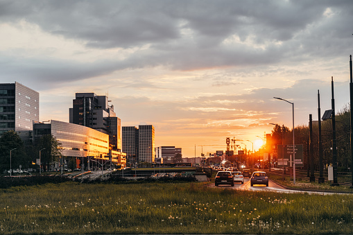 after work traffic modern in front of katowice skyline at sunset hour