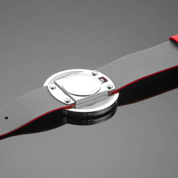 istock Close-up shot of a watch placed upside down on a reflecting surface. 1402096481