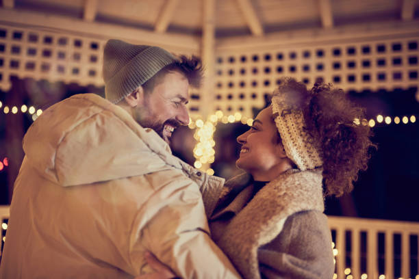Loving man and woman standing in their cottage room balcony