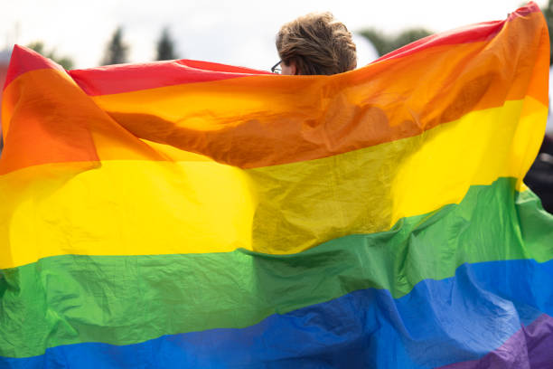 Proudly holding up large pride flag