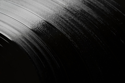Surface of an old vinyl record. Macro shot, shallow depth of field.