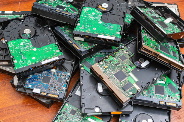 obsolete hard drives piled up for recycling - magnetic storage imagens e fotografias de stock