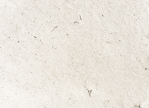 Very white and dry sandy soil as texture or background.