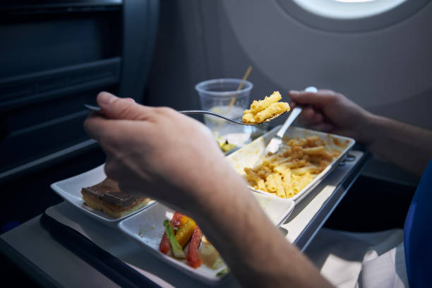 istock Passenger eating airline meal during long haul flight