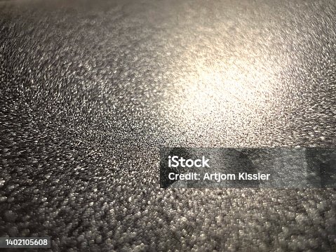 istock A macro image of a beautiful black metallic material. 1402105608