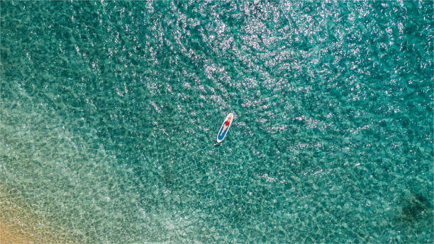 istock Woman enjoys relaxation on a paddle board 1402107587
