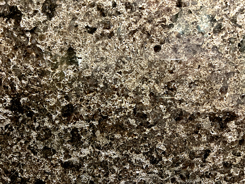 A macro image of a dark marble tile.