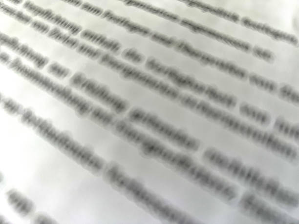 a close-up of text, specifically the letters, with blurred, highlighting the effects of selective focus and depth of field