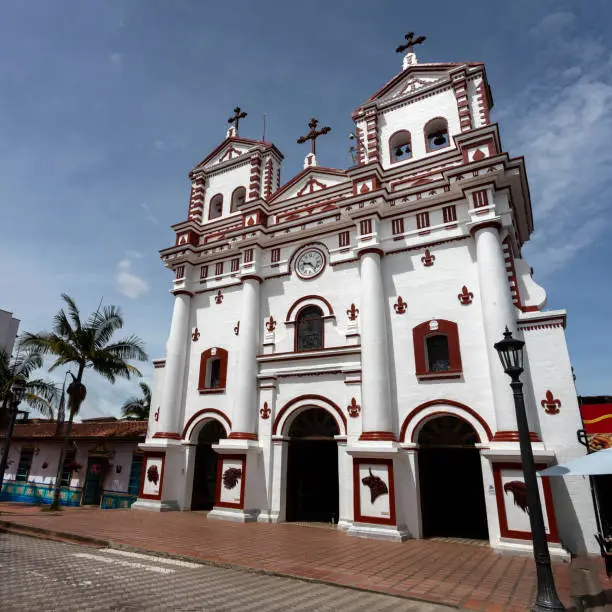 Guatape, Antioquia / Colombia - May 25, 2022. Church of Our Lady of Carmen, In 1930 it was endowed with benches, bells, French