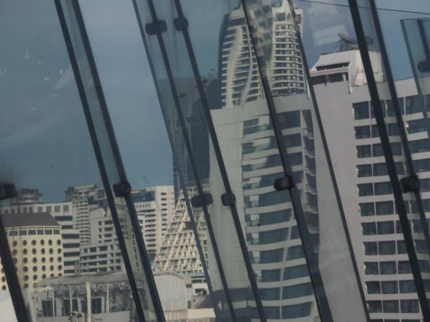 istock Black gray glass and gray white building 1402109740