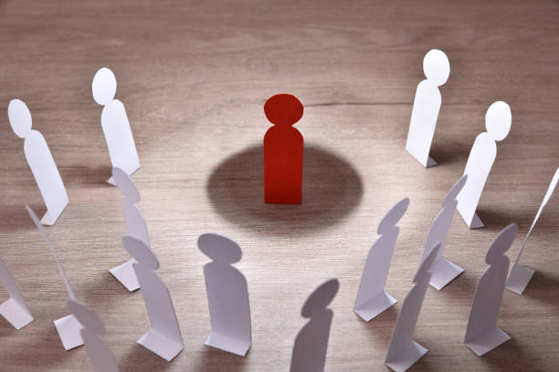istock Social discrimination many paper men front dark 1402110058
