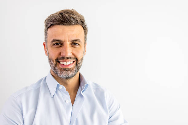 smiling mature man on white background - men human face smiling mature adult imagens e fotografias de stock