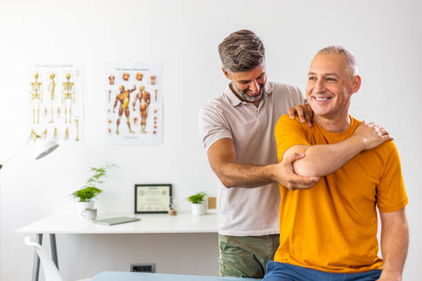 istock Modern rehabilitation physiotherapy worker with male client 1402115186
