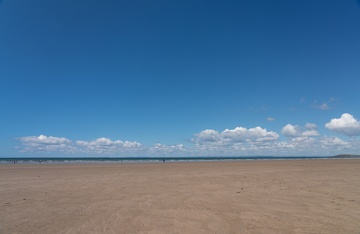 Looking out across the spectacular Rhossili Bay Beach on the Gower Peninsula, Wales.