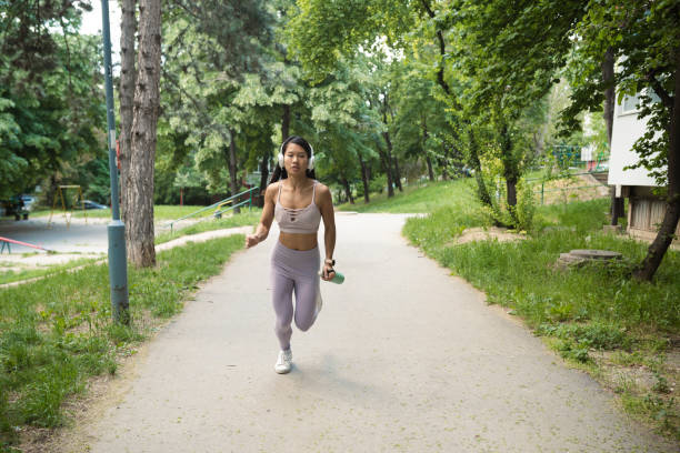 istock Asian young woman running 1402117673