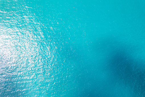 Sea surface aerial view,Bird eye view photo of blue waves and water surface texture, Turquoise sea background Beautiful nature Amazing view seascape background