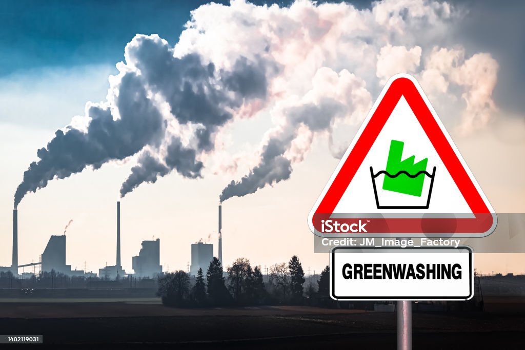 Greenwashing Concept Warning Against Greenwashing on a Sign that looks like a European Road Sign Greenwashing Stock Photo