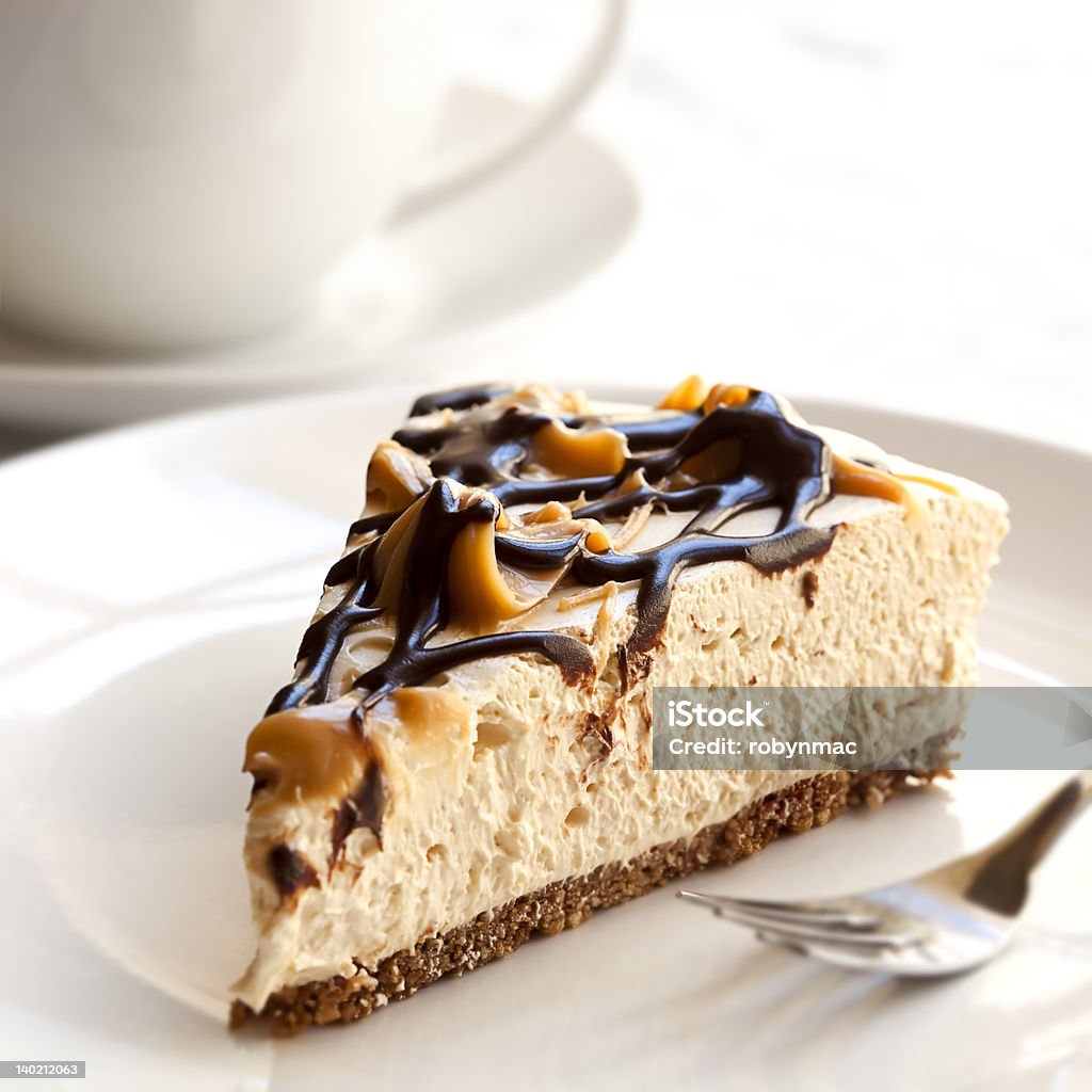 Cheesecake and Coffee Caramel and chocolate cheesecake with a cup of coffee. Cheesecake Stock Photo