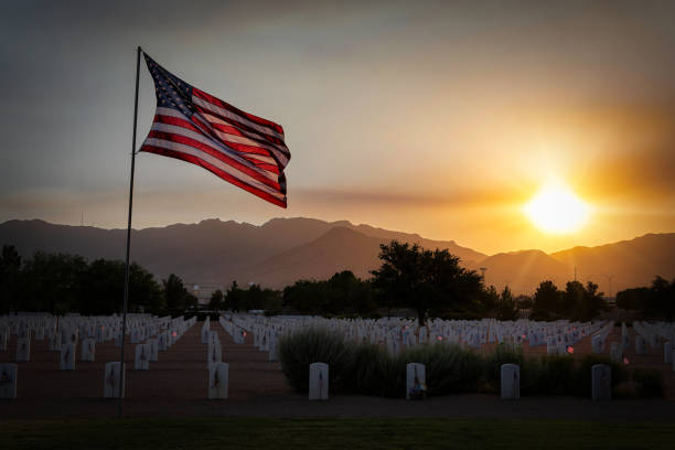 Memorial Day 2022 2 The wind blows on the night before Memorial Day at a west Texas national cemetery. national cemetery stock pictures, royalty-free photos & images