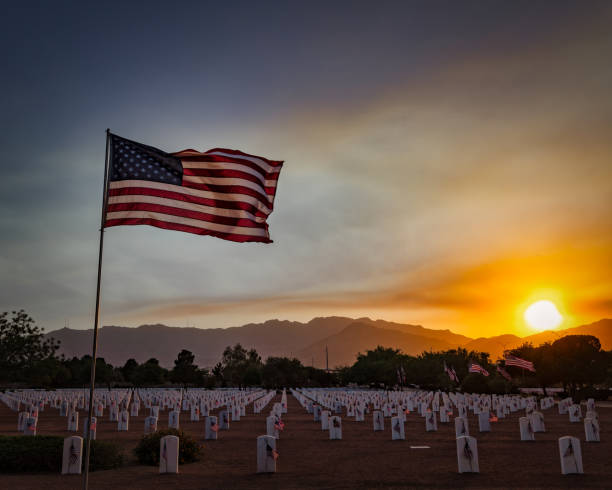 Memorial Day 2022 3 A windy evening on the evening before Memorial Day at Fort Bliss National Cemetery in El Paso, Texas. national cemetery stock pictures, royalty-free photos & images