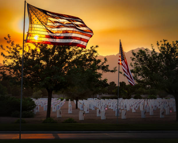 Memorial Day 2022 1 The wind blows on the night before Memorial Day at a west Texas national cemetery. national cemetery stock pictures, royalty-free photos & images