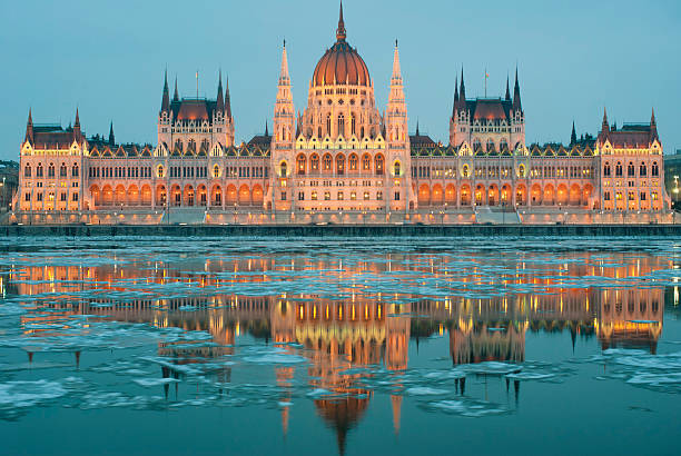 Hungarian parliament building at winter, ice drift on the Danube river (Budapest)