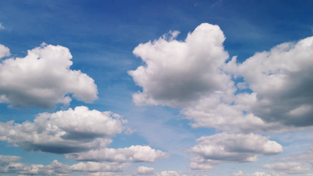 istock Fluffy clouds on the blue sky. Drone panning. 1402129076
