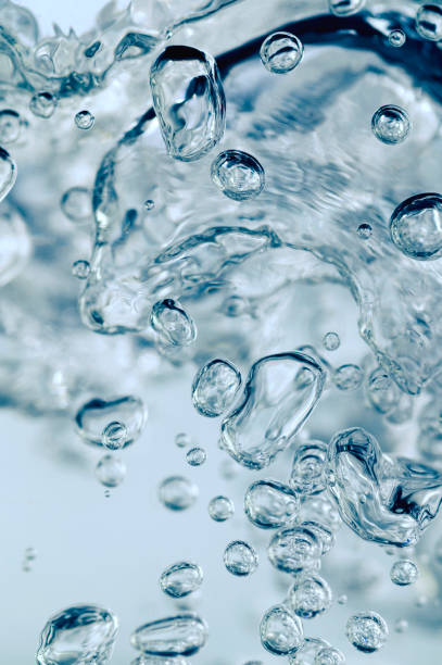 istock Close up of transparent air bubbles in water. 1402129131
