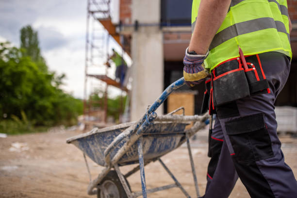 istock Unrecognizable male construction worker, pushing the cart with cement 1402129435